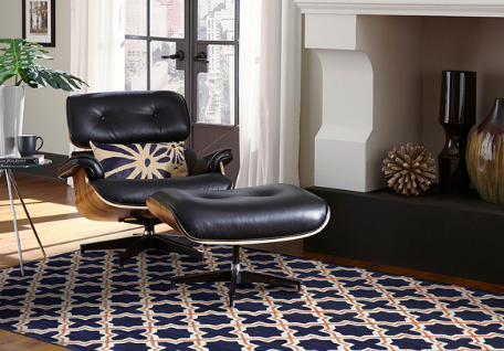 Karastan geometric pattern rug with leather chair. 